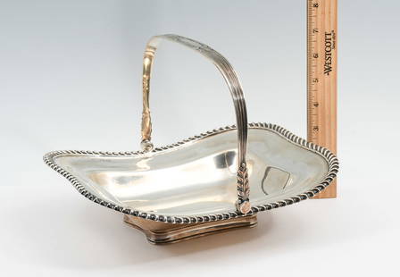 ENGLISH HENRY ATKIN EDWARDIAN STERLING BASKET: ENGLISH HENRY ATKIN EDWARDIAN STERLING BASKET: Approx. 27.27 Troy ounces. A shaped footed dish with handle, of Sterling Silver. Made by Henry Atkin, of Sheffield, England. Dated 1907. Appropriate