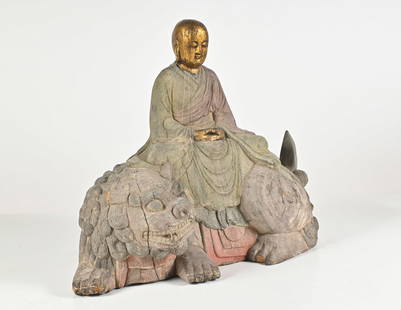 EARLY TIBETAN CARVED WOODEN BUDDHA ON FOO LION: EARLY TIBETAN CARVED WOODEN BUDDHA ON FOO LION: Carved & Polychromed 18th-Century Chinese Tibetan Foo Lion with a Gilt Buddha rider. Buddha is resting in a Meditative position. Approx. 14.75'' h x