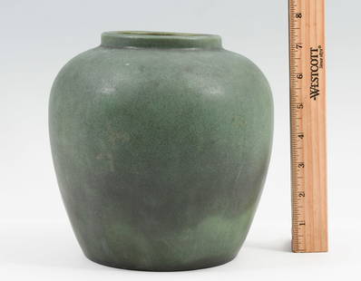 TECO POTTERY VASE: TECO POTTERY VASE: Teco Pottery green vellum matte glaze vase having a broad-shouldered form tapering slightly downwards. With impressed maker's mark stamped to the underside and incised shape no. 147