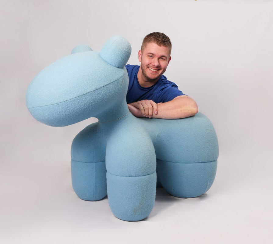 EERO AARNIO BLUE PONY CHAIR: EERO AARNIO BLUE PONY CHAIR: Upholstered all over in blue cloth, no label or tag present. Designed by Aarnio for Adelta, Finland. Overall measures approx. 31.75" h. x 46" x 21".