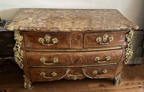 EARLY LOUIS XV STYLE POSSIBLY PERIOD ORMOLU MOUNTED MARBLE TOP COMMODE: EARLY LOUIS XV STYLE POSSIBLY PERIOD ORMOLU MOUNTED MARBLE TOP COMMODE: A remarkable French Louis 15th commode tombeau topped by a beveled marble surface over four dovetailed drawers in three rows, be