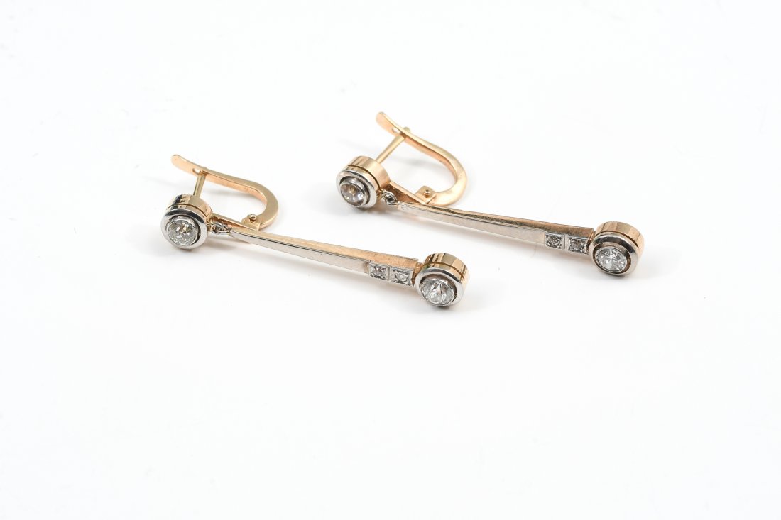 PAIR OF ART DECO PERIOD EAR DROPS: PAIR OF ART DECO PERIOD EAR DROPS: Belle Epoque / Art Deco era 14K yellow gold and platinum drop earrings set with 8 Old European round cut diamonds weighing approx. .65 Ct. Rated VS-SI in clarity and