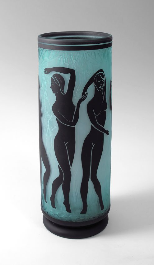 DUNCAN McCLELLAN CYLINDRICAL NUDES VASE: McCLELLAN, Duncan, (American 1955-): A 19 7/8'' tall cylindrical vase featuring nude silhouettes, black over turquoise, acid etched. The background also has raised detail of a forest. 6 1/2'' dia. Ori