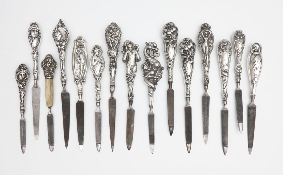 COLLECTION ART NOUVEAU STERLING NAIL FILES: COLLECTION ART NOUVEAU STERLING NAIL FILES: 15 pieces to include 1) Full figure of a woman in sheer dress, marked Sterling. 2) Large flower atop, marked Sterling H. 3) Woman's face atop looking left, 