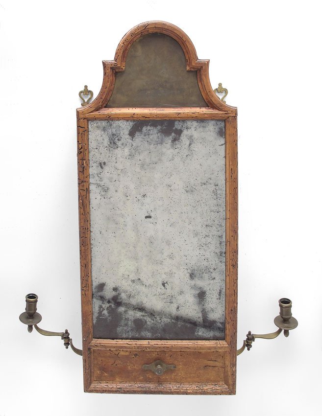 EARLY FRENCH WALL MOUNT SHAVING MIRROR: EARLY FRENCH WALL MOUNT SHAVING MIRROR: Original looking glass and brass swing arm candle holders. The hinged mirrored door opens to shelved storage. The wood has a warm patina with old worm holes. Me