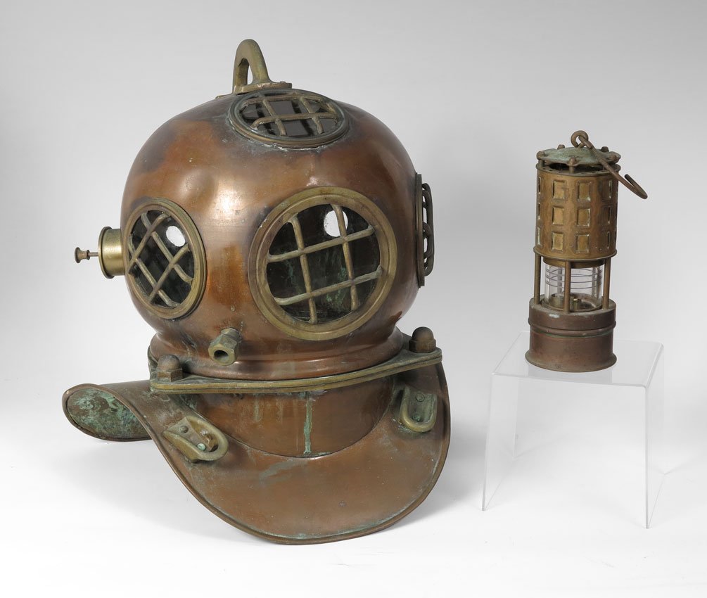 COPPER & BRASS DIVING HELMET: COPPER & BRASS DIVING HELMET: Decorative example copper and brass construction. Unmarked. Measures 18 3/4" h. x 17 1/2" x 16". Sold with a vintage Koehler ships oil lantern. 9 1/2" h. x 3 3/4".