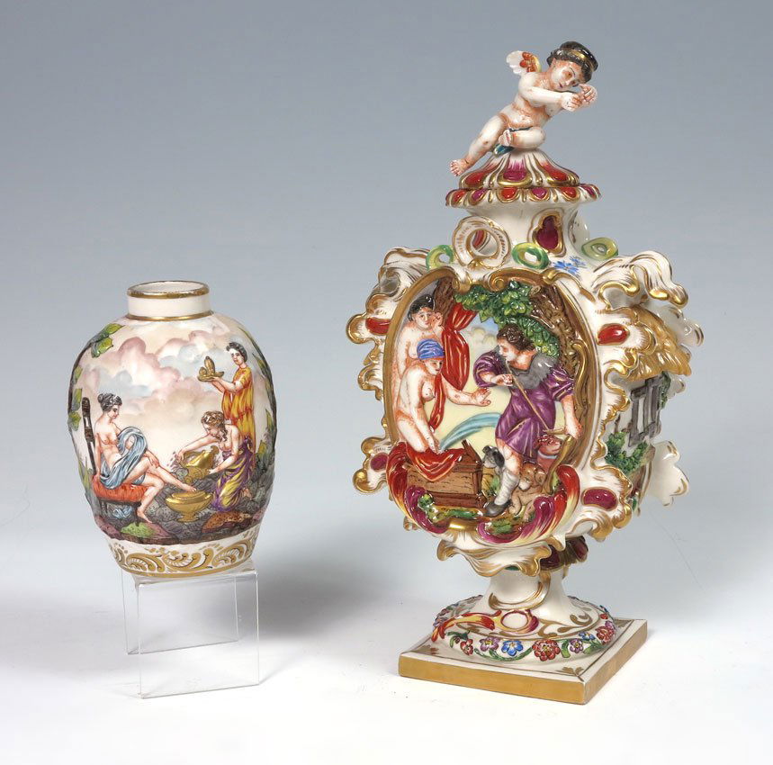 CAPO-DI-MONTE COVERED URN AND VASE: CAPODIMONTE PORCELAIN COVERED URN & VASE: The urn surmounted by a winged cherub. Raised images in the classic Italian manner. Urn 11" tall (with lid), vase is 4 1/2".