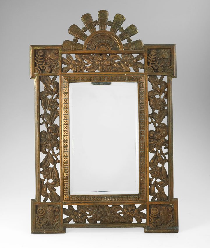 ART NOUVEAU PATINATED METAL TABLE TOP MIRROR: ART NOUVEAU PATINATED METAL TABLE TOP MIRROR: Frame with figural half sun crest, open work floral motif sides and vignettes of birds in corners. Unmarked. Easel back support: 15 3/4" h. x 10 1/2".