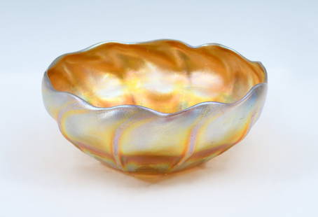 TIFFANY FAVRILLE GOLD AURENE FLORIFORM BOWL: TIFFANY FAVRILLE GOLD AURENE FLORIFORM BOWL: Louis Comfort Tiffany Favrille Glass Floriform bowl. Underside signed L.C.T. Favrille. Approx. 3.25'' h x 8'' dia.