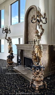 PAIR OF BRONZE SEMI-NUDE FEMALE TORCHIERE LAMPS: PAIR OF BRONZE SEMI-NUDE FEMALE TORCHIERE LAMPS: An opposing pair of Gilt Bronze semi-nude Female Torchieres, with each having 9- lights. Ladies are adorned by strands of bountiful garlands, and are