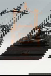 BRONZE FLYING PENDULUM SKELETON CLOCK