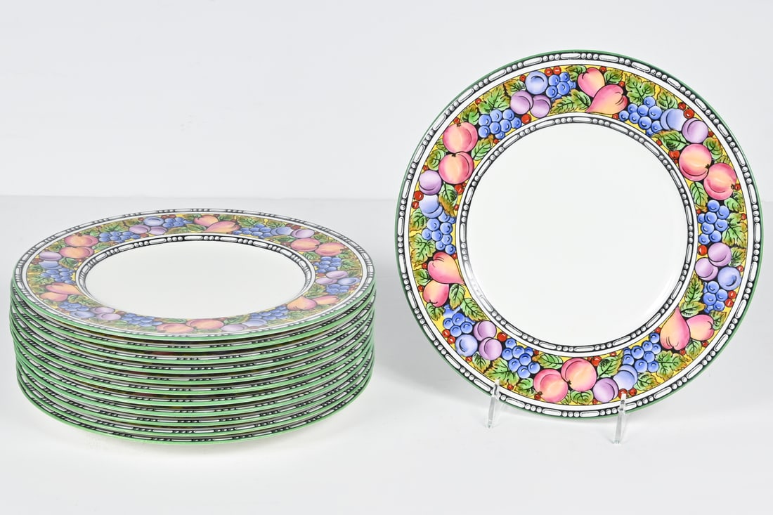 12 PC. WEDGWOOD FRUIT MOTIF DINNER PLATES: 12 PC. WEDGWOOD FRUIT MOTIF DINNER PLATES: A 12-piece set of Wedgwood dinner plates with striking fruit motif borders. Each having a green Wedgwood backstamp underneath. Approx. 10 5/8'' dia.