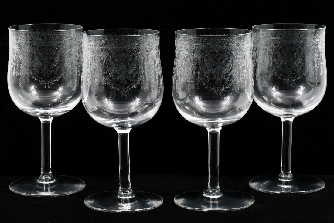 SET OF 4 ROOSEVELT PRESIDENTIAL WINE GLASSES: SET OF 4 ROOSEVELT PRESIDENTIAL WINE GLASSES: Each deep bowl etched with the Great Seal of the United States within a decorative band, raised on a plain stem and foot. Used with Roosevelt's 1902 White