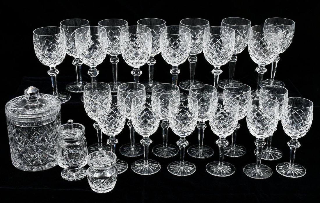 LARGE COLLECTION OF WATERFORD GLASSWARE: LARGE COLLECTION OF WATERFORD GLASSWARE: This collection of Waterford crystal includes: 12- Powerscourt hock wine glasses, 12- Powerscourt white wine glasses, 2- honey/jam jars, and, 1- Vase. Accompan