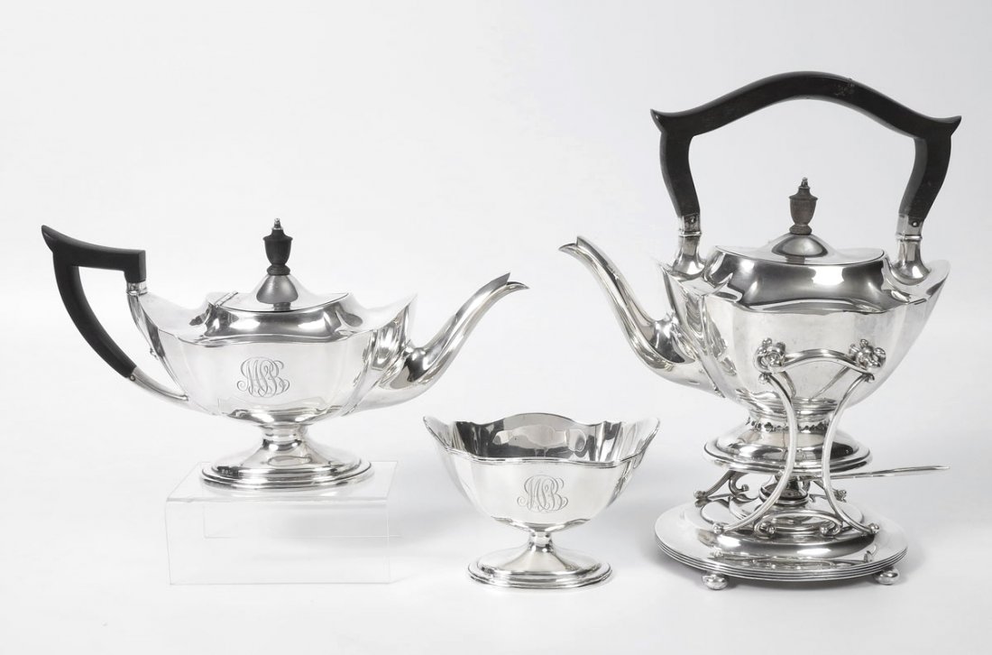SHREVE, CRUMP & LOW 3 PIECE STERLING TEA SERVICE: SHREVE, CRUMP & LOW 3 PIECE STERLING TEA SERVICE: To include 1) Hot water kettle with wooden handle and finial, hinged lid, on stand with removable burner. Teapot measures 9 1/2'' h. x 9 1/4'', stand 