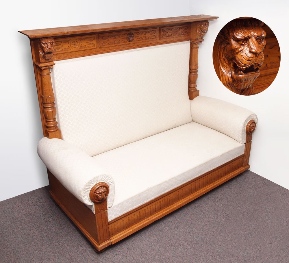 MASQUERON CARVED OAK HIGH BACK BENCH SETTEE DAY BED: MASQUERON CARVED OAK HIGH BACK BENCH SETTEE DAY BED: Carved applied decorative panels to top back with lion masqueron to center, surmounted by 2 half columns with carved figural lion head tops. Carved