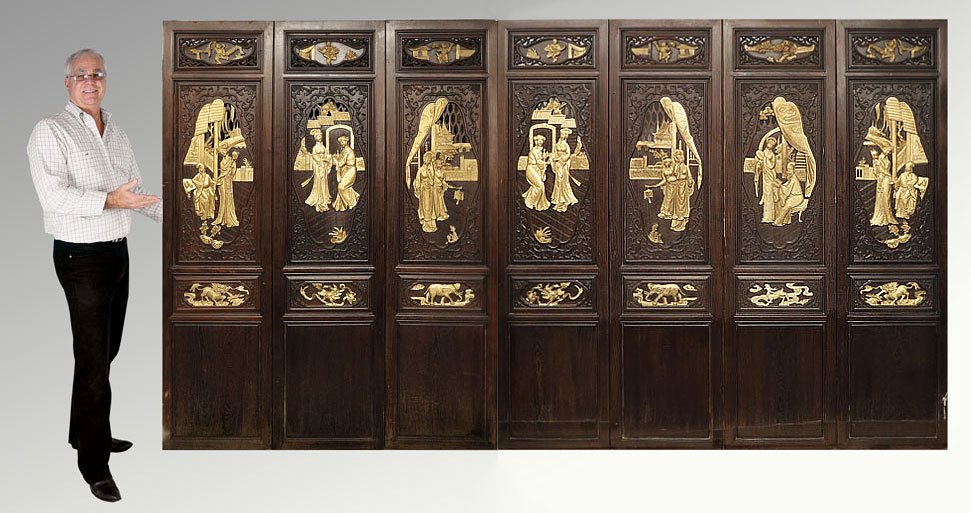 7 CHINESE ARCHITECTURAL CARVED WALL PANELS: SET OF 7 CHINESE CARVED WALL PANELS: Heavy carved wood panels. Carved and parcel gilt identical front and back. Groove fitted. Each Approx. 6'8'' tall x 21'' x 1 1/2''.