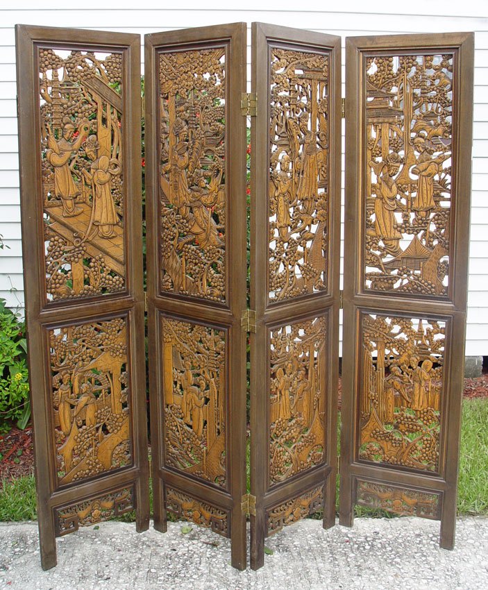 CHINESE CARVED 4 PANEL SCREEN: CHINESE CARVED 4 PANEL SCREEN: Pierce carved with oriental genre scenes in panels. Each panel 71 1/2" h. x 17 1/2".