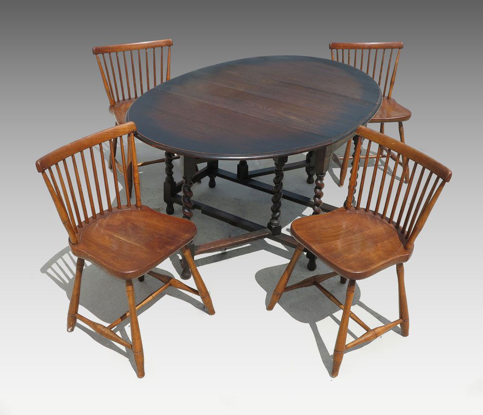 4 STICKLEY CHAIRS AND GATE LEG TABLE: 4 STICKLEY CHAIRS AND GATE LEG TABLE: Dark stain table with gate leg drop leaves and barley twist legs. Unmarked. 29" h. x 58 1/2" x 41 1/4". Sold with 4 chairs marked with L & JG Stickley labels unde