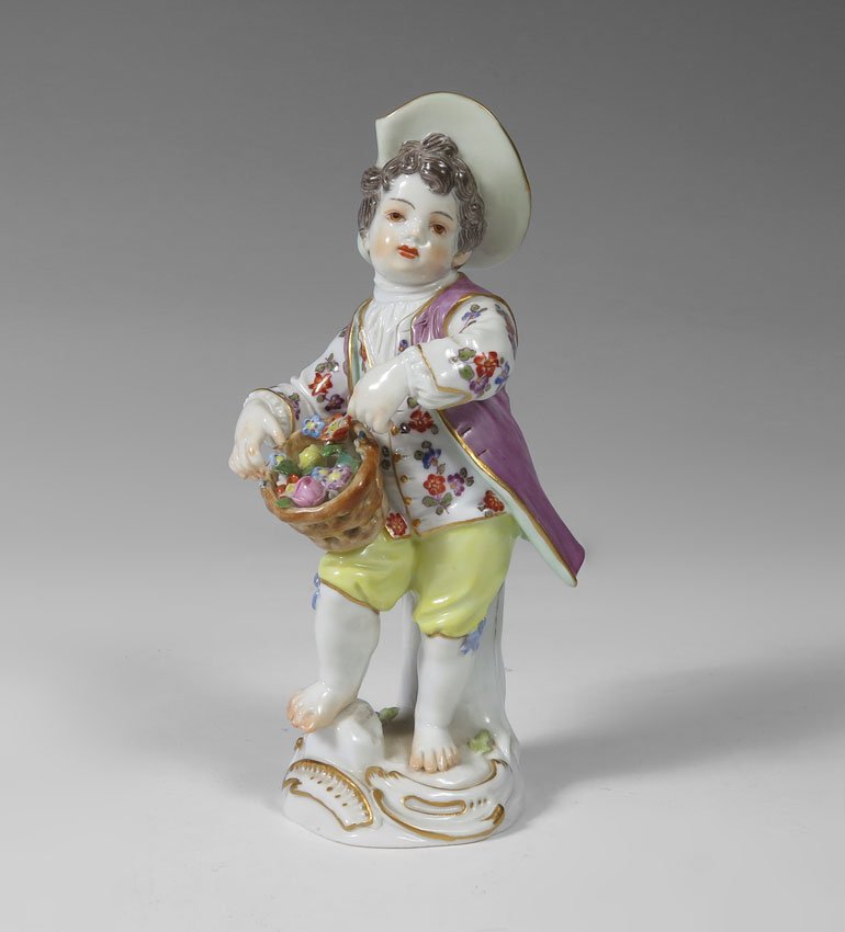 MEISSEN GERMAN PORCELAIN FIGURINE 4 1/2'' TALL: MEISSEN GERMAN PORCELAIN FIGURE: Young boy with flower gathering basket, 4 1/2'' tall. Blue cross sword mark under glaze.