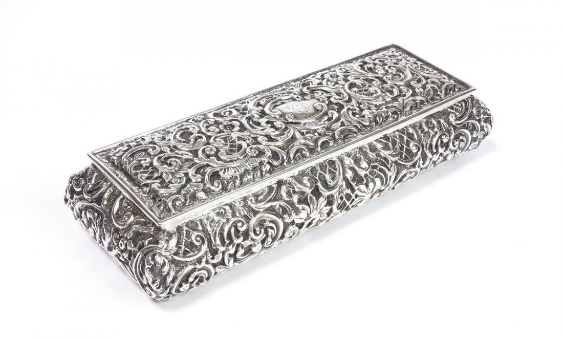 1902 HENRY MATTHEWS ENGLISH SILVER DRESSER BOX: 1902 HENRY MATTHEWS ENGLISH SILVER DRESSER BOX: Embossed with foliate scroll motif, hinged lid, hallmarked with Henry Matthews, Birmingham, 1902 English hallmarks. Monogrammed ''C''. Measures 1 3/4''