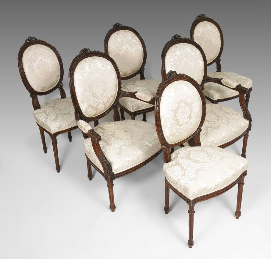 6 FRENCH STYLE CARVED DINING CHAIRS: 6 FRENCH STYLE CARVED DINING CHAIRS: 2 arm and 4 side chairs, carved frames with carved and turned legs. Ivory upholstery with French style pattern. Arm chairs 38 3/4" h. x 25 1/4" x 25".