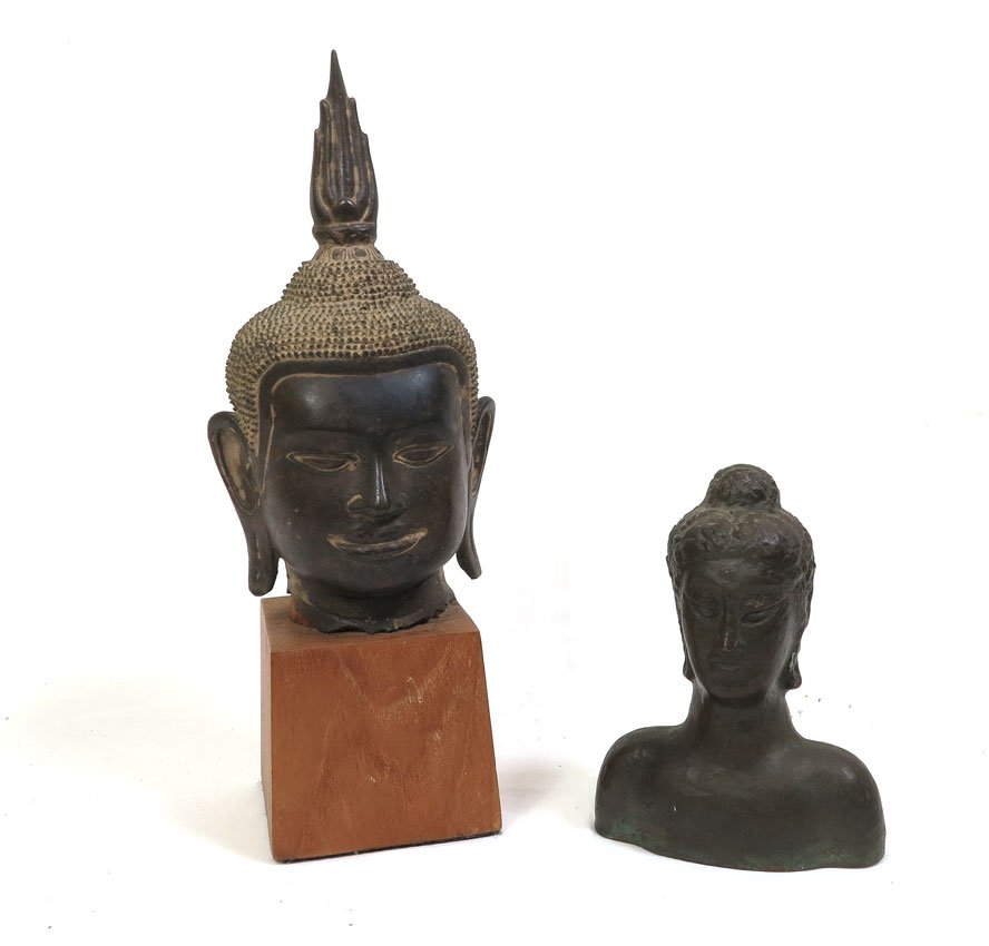 2 ANTIQUE BRONZE HEADS OF BUDDHA: TWO BRONZE HEADS OF BUDDHA: 1) Larger Thai patinated head, 10 1/2" high., excluding the 4" wood base. 2) Smaller Hindu bust, 6.75" x 5". Actual age unknown.