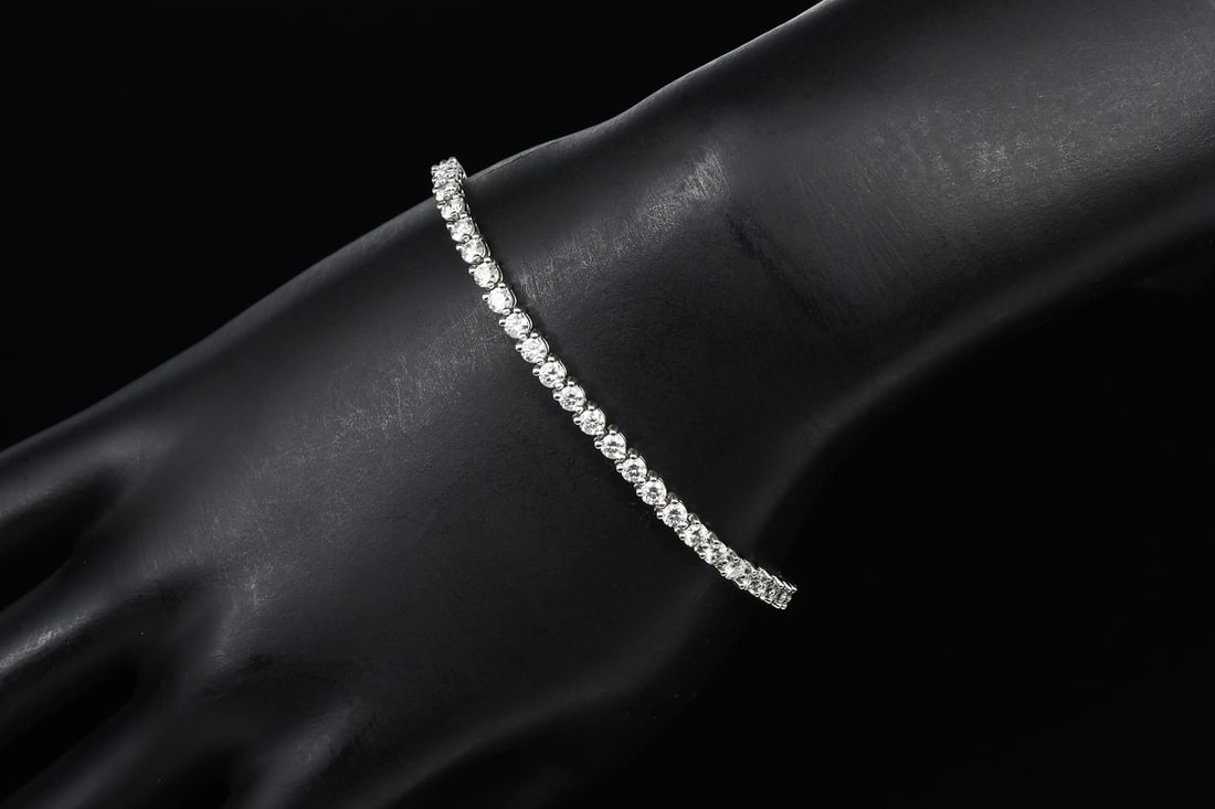 TIFFANY & CO. PLATINUM AND DIAMOND BRACELET: TIFFANY & CO. PLATINUM DIAMOND LINE BRACELET: This lovely diamond line bracelet is from the elegant and simply stunning Victoria Collection of Tiffany & Co. This heavy yet delicate, satiny smooth to t