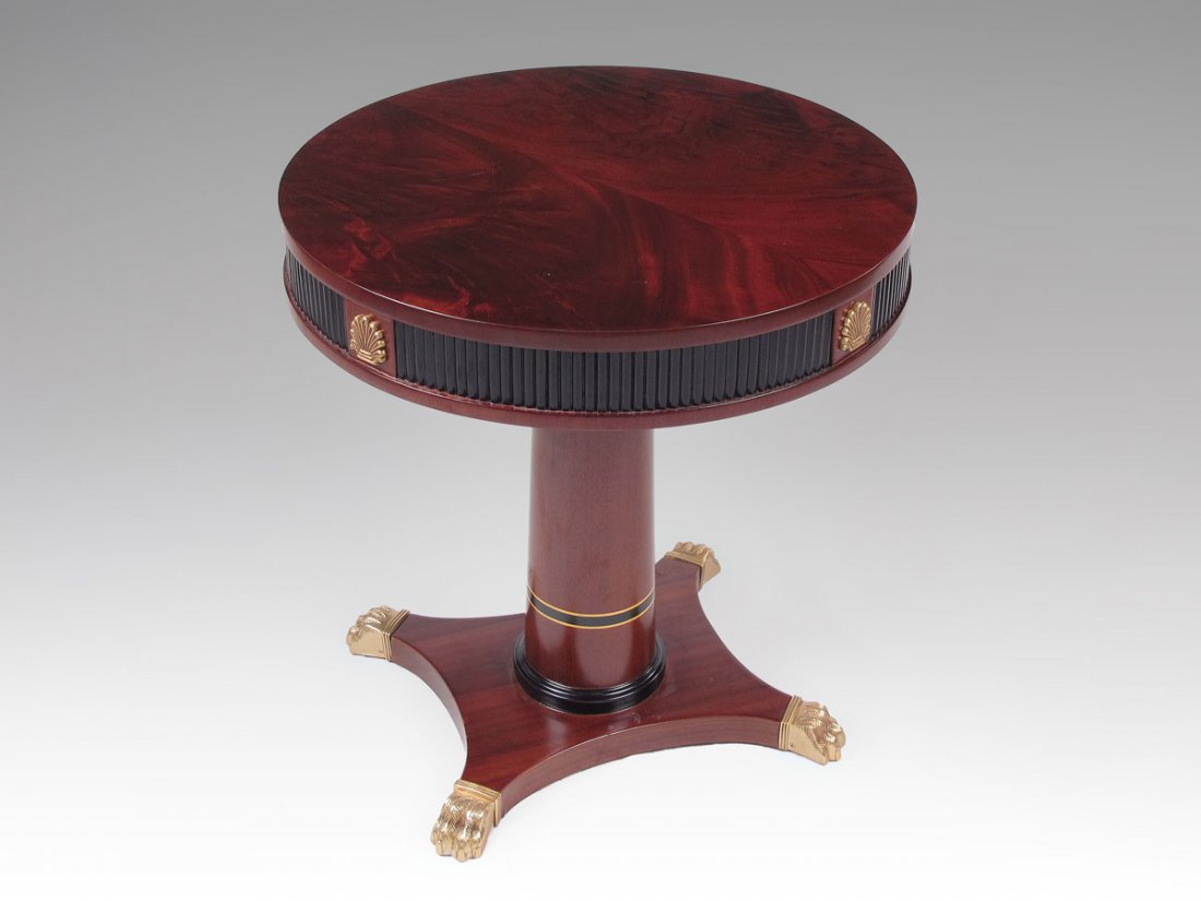 VERSACE DESIGNED DRUM TABLE: VERSACE DESIGNED DRUM TABLE: Mahogany with ormolu. Brass paw feet. 24 1/2'' h. x 23 3/4''.