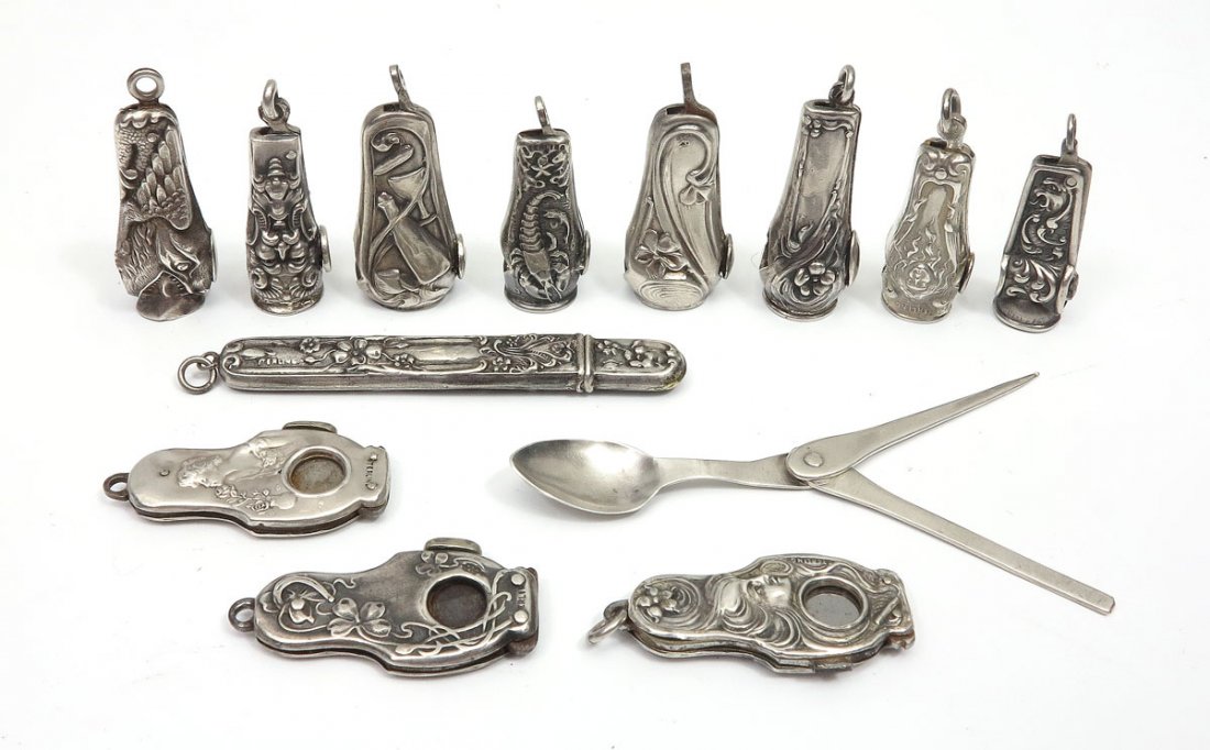 ART NOUVEAU STERLING SILVER CIGAR CUTTERS: ART NOUVEAU STERLING SILVER CIGAR CUTTERS: 12 cigar cutters for fob or vest pocket, and one pipe tool. All marked sterling. Cigar cutters: 3 women, 3 creatures (dog?), lobster and north wind or devil;