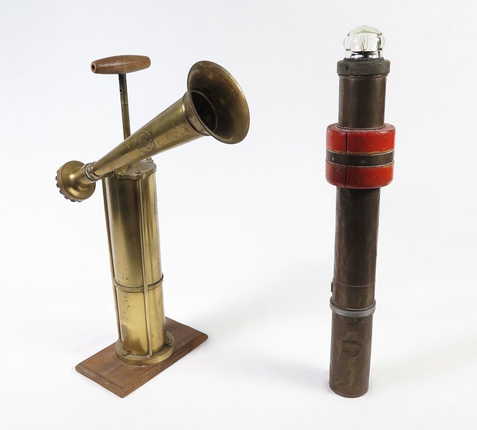 2 PIECE NAUTICAL SHIPS HORN & EMERGENCY BUOY LIGHT: 2 PIECE NAUTICAL SHIPS HORN & EMERGENCY BUOY LIGHT: To include 1) Swedish Tyfon ships fog horn mounted to wood base, bellows working. 23 1/2" h. x 13" x 6 1/2". 2) Otake Type 2 Self Igniting Light, se
