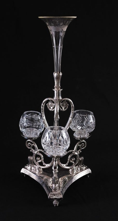 HENRY HOBSON & SONS ENGLISH SILVERPLATE EPERGNE: HENRY HOBSON & SONS ENGLISH SILVERPLATE EPERGNE: Etched glass center bud vase over silverplate base with foliate and Egyptian Revival motifs. Marked on base H.H. & S, 43613. Sold with cut glass jars o