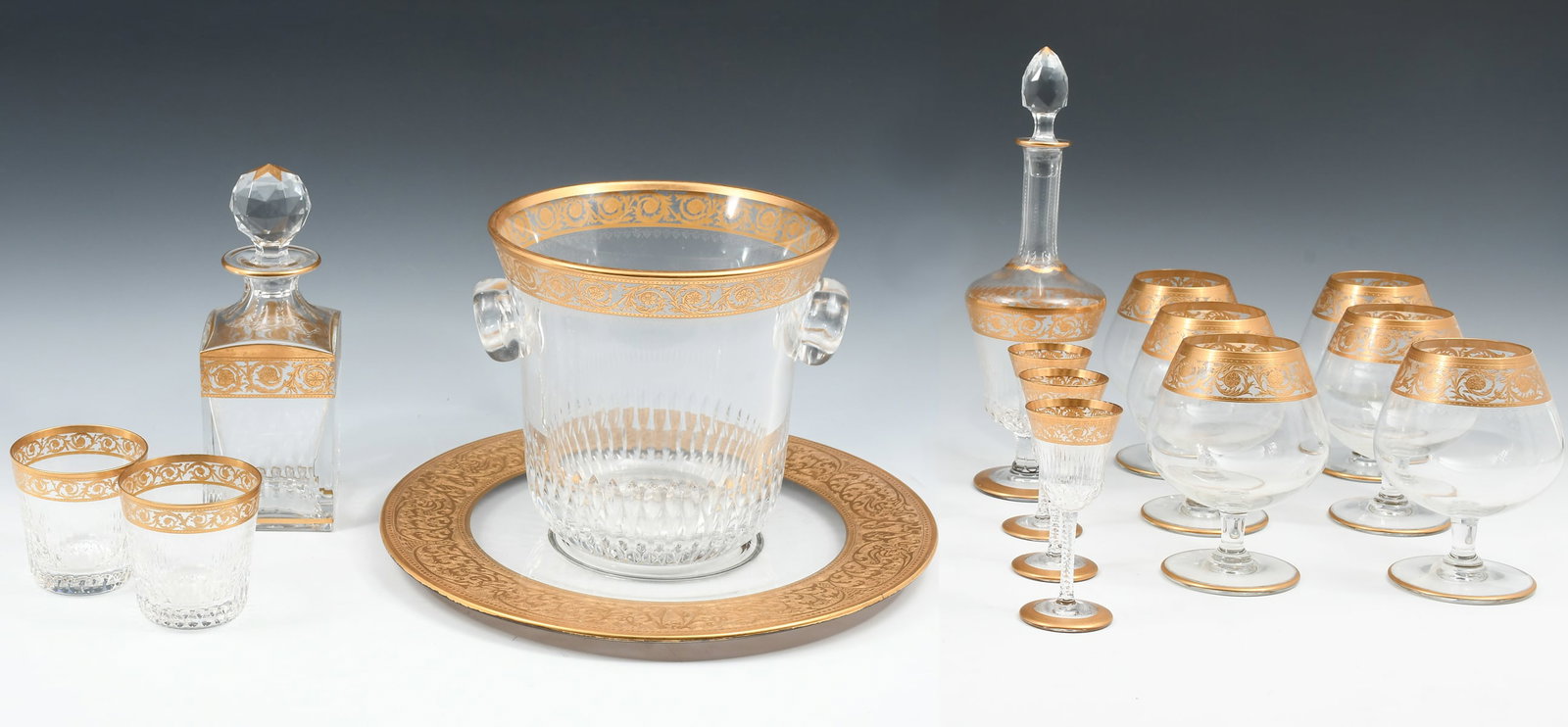 15 PC. FRENCH ST. LOUIS CRYSTAL "THISTLE GOLD": 15 PC. FRENCH ST. LOUIS CRYSTAL "THISTLE GOLD" BAR SET: Comprising; 1- Champagne / Wine Bucket, 2- Rocks Glasses, 6- Snifters, 3- Cordials, & 2- Decanters. Also included is a large serving dish of a d