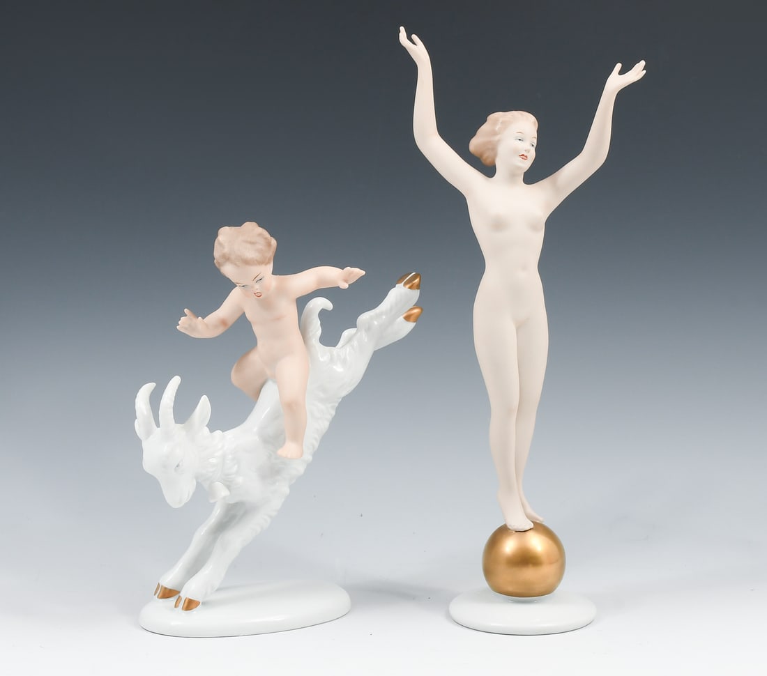 2 PC. WALLENDORF PORCELAIN NUDE FIGURES: 2 PC. WALLENDORF PORCELAIN NUDE FIGURES: Comprising; 1- Art Deco Nude Woman standing upon a Gold Ball. 1- Nude Boy riding on back of a Goat. Both marked at the undersides. Tallest Approx. 11.5" h.