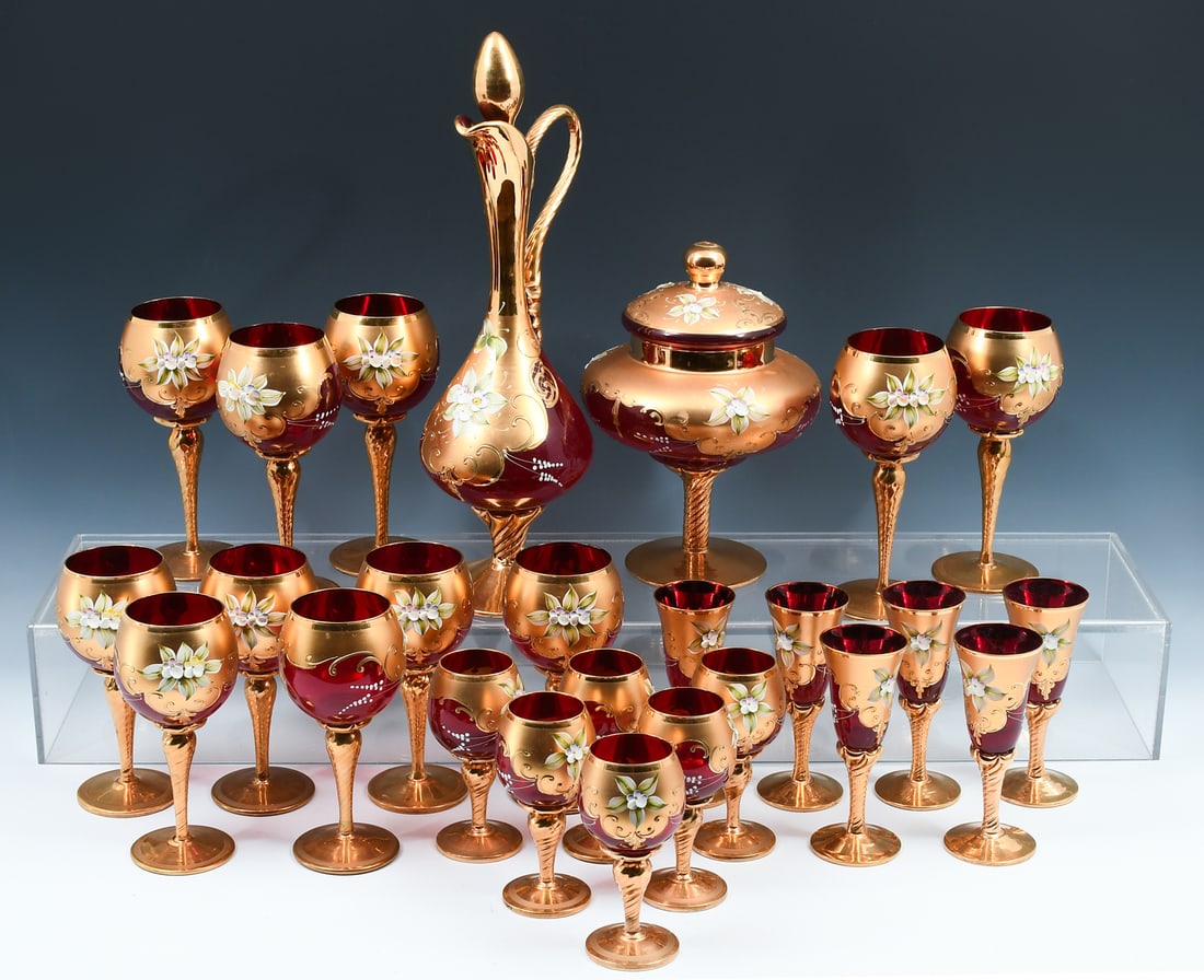 VINTAGE ITALIAN FLORAL DECORATED GILT STEMWARE: VINTAGE ITALIAN FLORAL DECORATED GILT STEMWARE: 25 pieces of vintage Italian stemware, made of red glass and decorated with floral designs. Comprising: 11- Tall wine goblets; 6- Wine goblets; 6- Lique
