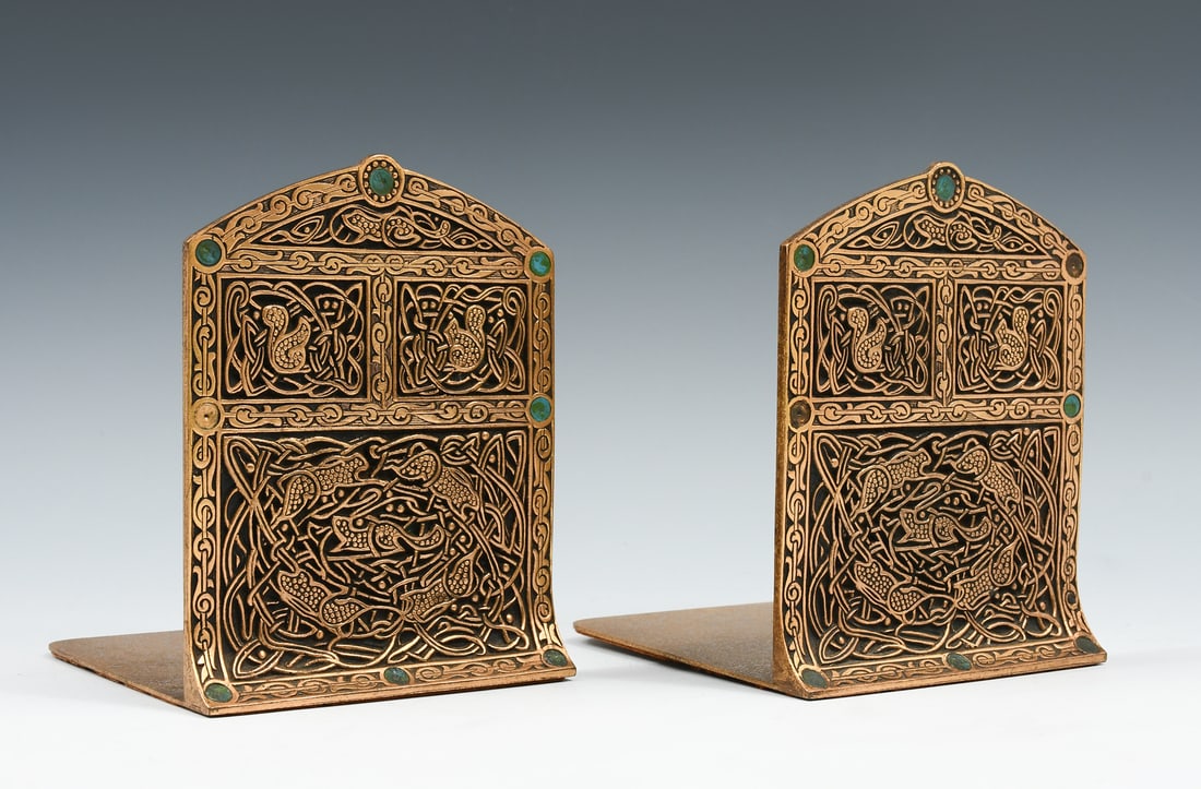 TIFFANY STUDIOS GILT BRONZE "9TH-CENTURY" BOOKENDS: TIFFANY STUDIOS GILT BRONZE "9TH-CENTURY" BOOKENDS: A pair of Tiffany Studios gilt bronze bookends in the "ninth century" pattern. Early 20th century. New York. Each stamped: "Tiffany Studios, New Yor