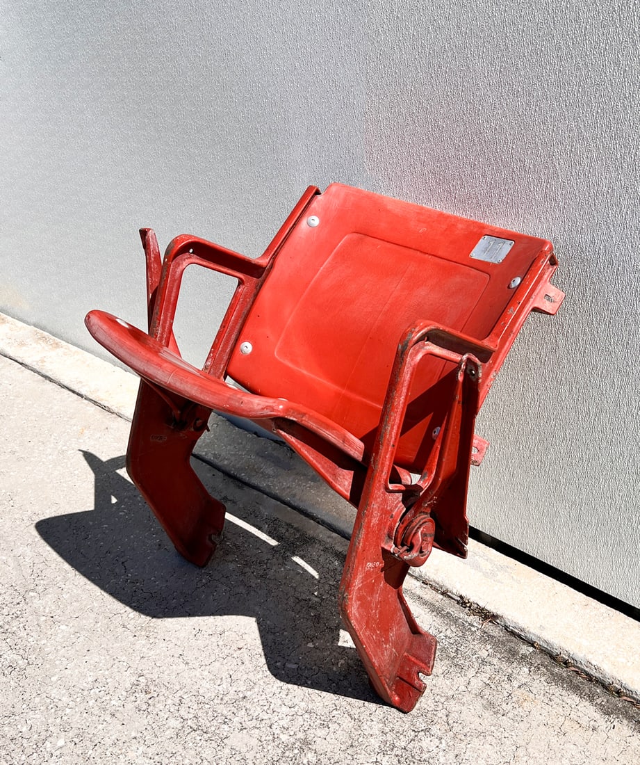 ANAHEIM ANGELS STADIUM SEAT: ANAHEIM ANGELS STADIUM SEAT: Seat #11 from the Angel's Anaheim Stadium, having a red plastic spring loaded seat & backrest. Mounted to a red painted cast iron frame. Spring loaded seat supports for ch