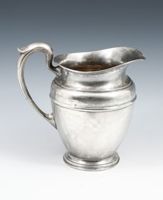 AN IMPORTANT INTERNATIONAL STERLING WATER PITCHER
