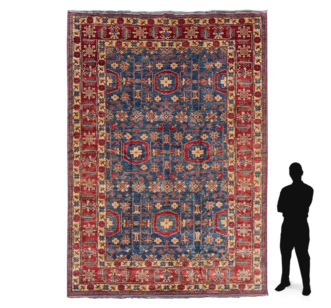 TURKISH HAND KNOTTED WOOL RUG: TURKISH HAND KNOTTED WOOL RUG: A pretty medium blue field is covered with small geometric shaped designs in colors that include red, pale pink, and yellow. The wide red main border is framed by yellow