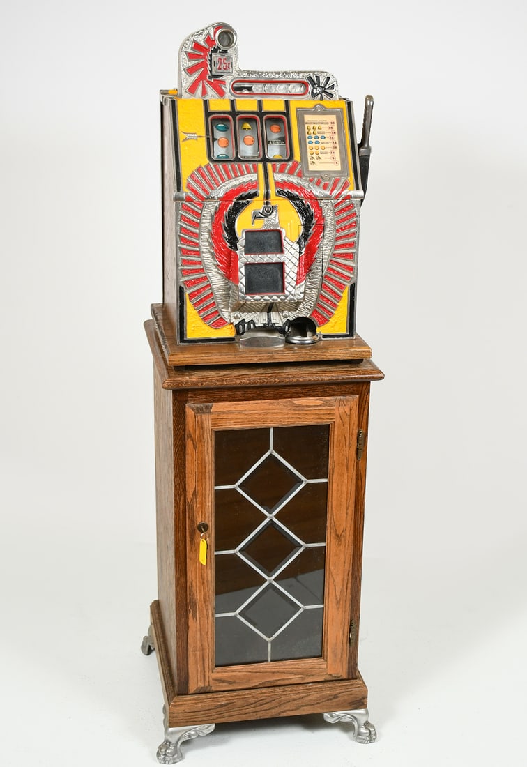 MILLS 25 CENT WAR EAGLE SLOT MACHINE: MILLS 25 CENT WAR EAGLE SLOT MACHINE: Awesome original 25 cent Mills war eagle slot machine. Original paint. Resting upon an Oak base with a leaded glass door (Key Present). Raised on metal Paw feet. 