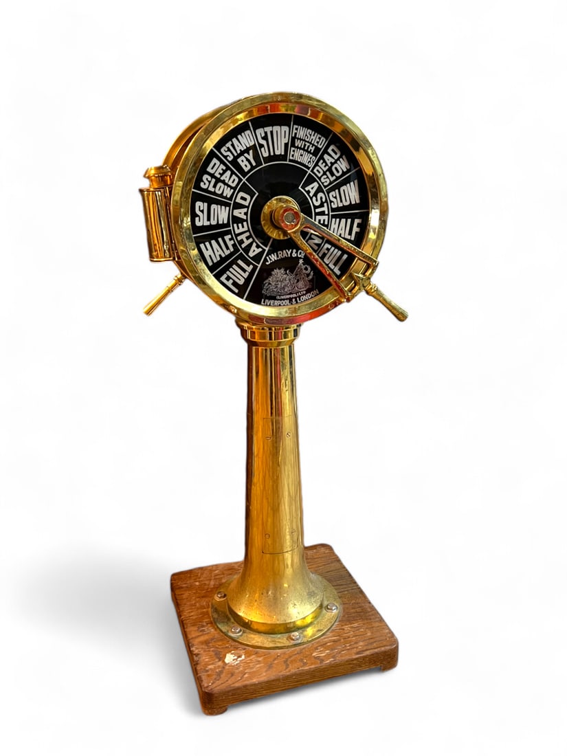 ENGLISH W. RAY & CO. SHIP'S TELEGRAPH: ENGLISH W. RAY & CO. SHIP'S TELEGRAPH: J. W. Ray & Co. Liverpool, London brass ship's bridge telegraph with double black face plates reading standard commands. Oil Lamp resides in a side compartment. 