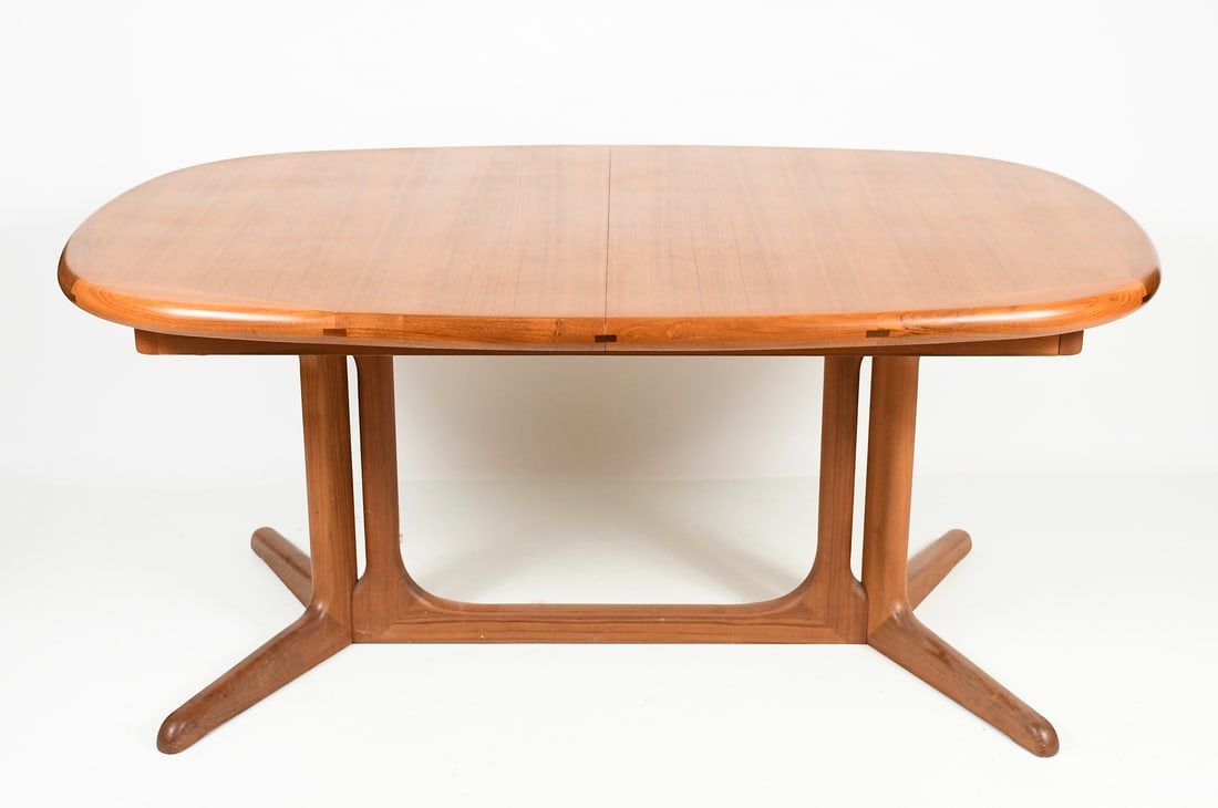 DANISH MID-CENTURY MODERN TEAK TABLE: DANISH MID-CENTURY MODERN TEAK TABLE: K.D. Furniture Teak dining table, having Two self-contained leaves. Approx. 28" h x 63" l x 41.25" w. With Leaves Approx. 106.5" l.