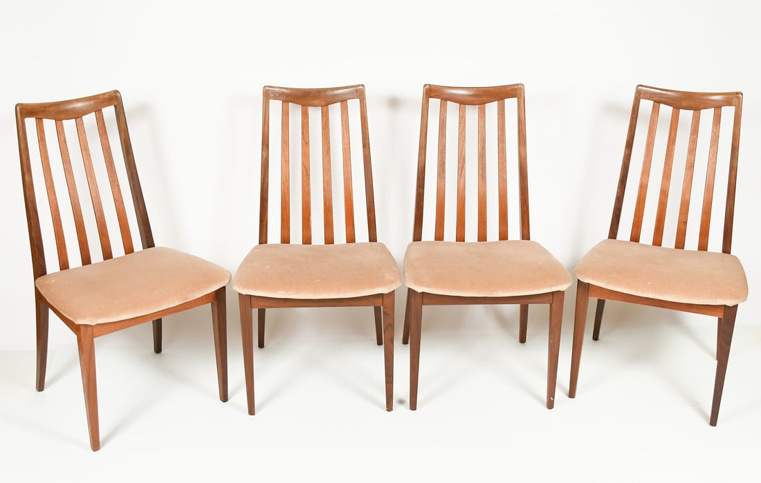 4 PC. G-PLAN MID-CENTURY MODERN TEAK DINING CHAIRS: 4 PC. G-PLAN MID-CENTURY MODERN TEAK DINING CHAIRS: A set of Four MCM Dining chairs with contoured slat backs. Raised on tapered square legs. Tags at the undersides. Approx. 36" h x 19.5" w x 21" d.