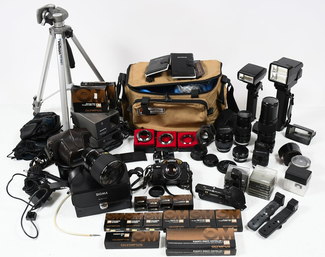 OLYMPUS OM-4 FULL CAMERA OUTFIT: OLYMPUS OM-4 FULL CAMERA OUTFIT: To Include: 1) Olympus OM-4 camera, serial no. 1028482, w/ recordata back 4, leather case, and G. Zuiko 50mm f/1.4 lens; 2) Sigma 600mm F/8 lens; 3) Olympus 75-150 f/4