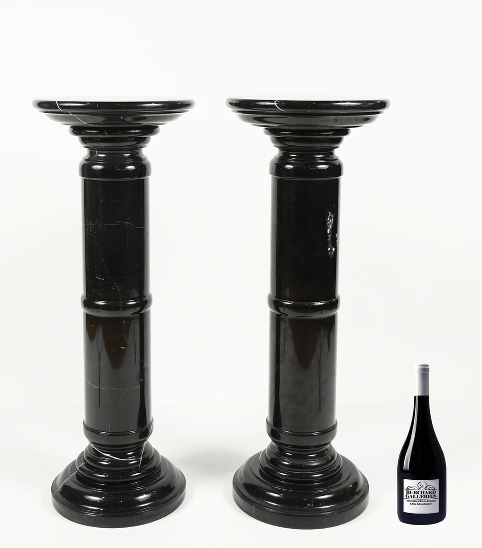 PAIR OF POLISHED BLACK BELGIAN MARBLE PEDESTALS: PAIR OF POLISHED BLACK BELGIAN MARBLE PEDESTALS: A pair of stately black marble pedestals, suitable for any statue or lamp that can fit atop it. Both measure 35.5” in height, with surface platfo