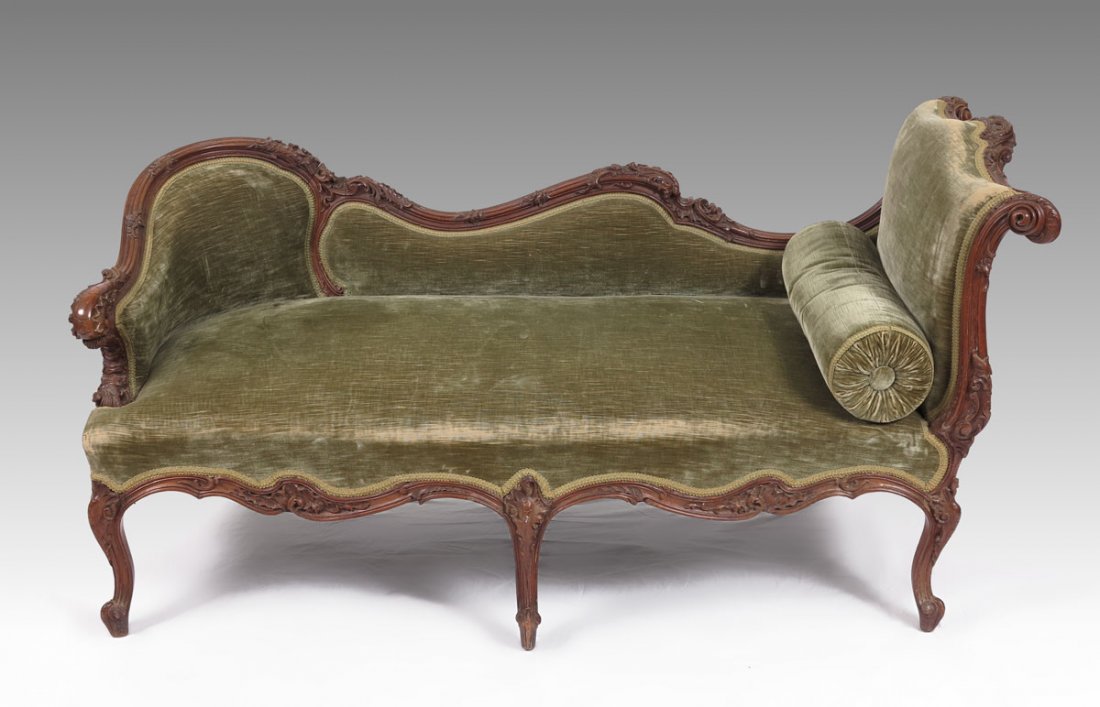 DIMINUTIVE CARVED FRENCH RECAMIER DAYBED: DIMINUTIVE CARVED FRENCH RECAMIER / DAYBED: Rocaille carved walnut frame, deep green upholstery. Measures approx. 29''h x 23'' x 55''l. Purchased from the estate auction of Bob Bugnand, and is said to