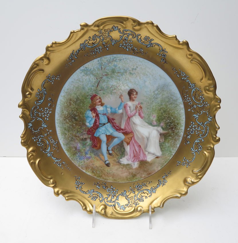 FRENCH LIMOGES CABINET PLATE: FRENCH LIMOGES CABINET PLATE: Flambeau China, Ca. 1890's. Ornate wide gold border with blue enameling, at the center is a paint enhanced image of a courting couple. Measures 13'' dia.