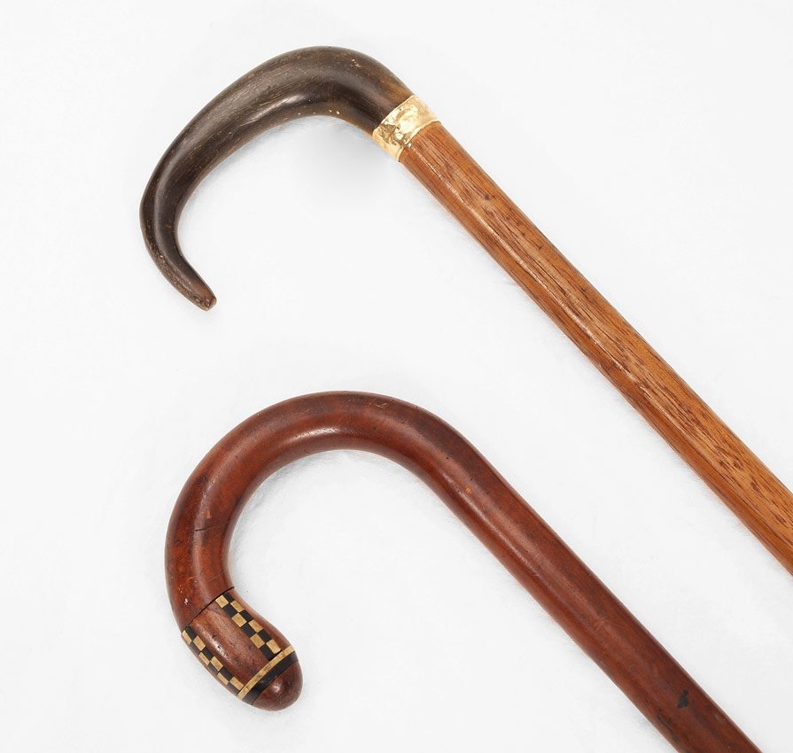 2 PIECES FOLK ART WALKING STICK / CANE: 2 PIECE WALKING STICKS / CANES: To include 1) Bent wood handle with inlaid section, hardwood shaft, applied rubber tip. 33 3/4" l. 2) Horn handle, 14k gold collar, hard wood shaft with rubber tip. 35