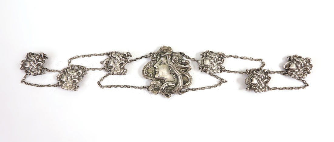 ART NOUVEAU STERLING FIGURAL MEDALLION BELT: ART NOUVEAU STERLING FIGURAL MEDALLION BELT: Marked Sterling on back of the 7 medallions, each with figural bust of woman with flowing hair. 25 1/4'' l., approx. 1.8 troy oz.