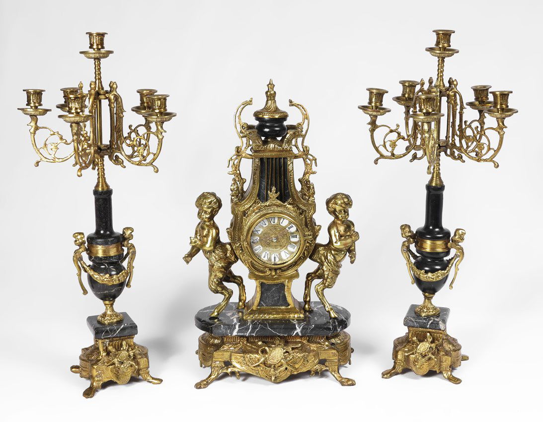 GILT METAL & MARBLE FIGURAL CLOCK GARNITURE SET: GILT METAL & MARBLE FIGURAL CLOCK GARNITURE SET: Clock with gilt cast metal Pan figures, cast base and marble shelf and accents. Lyre shape case, quartz movement. Unmarked as to maker or retailer, we